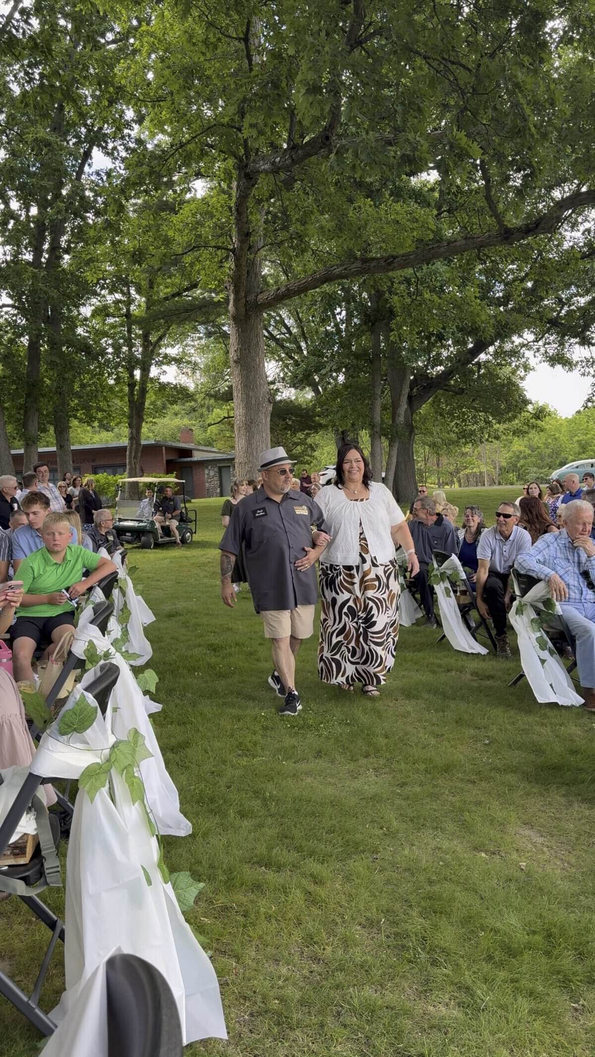 Guests walking through outdoor event at Camp Happily Ever After.